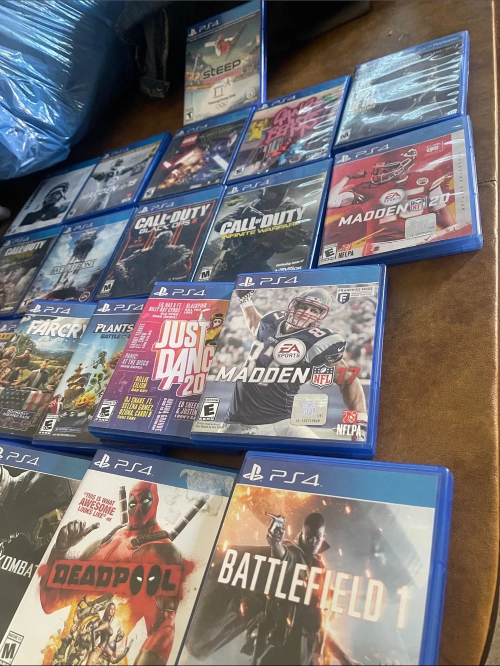Sony PS4 Game Lot with Blue Case Covers